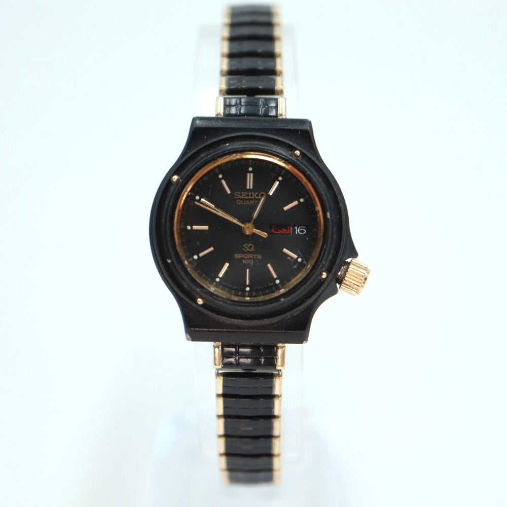 Vintage Womans Seiko SQ Sports 100 Watch Black Gold Arabic 2A23-0069 New Battery